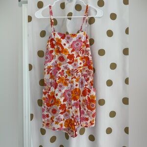 Midnight Doll floral romper with tie in the back